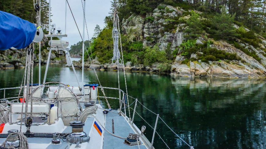 Anchoredin the Fjords with a line ashore