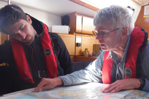 RYA-Theory-Course-Two-blokes-looking-at-chart-feature