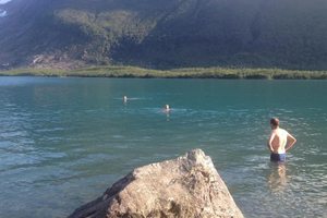 Santosa’s Arctic Circle Swim Club Dips Beside A Glacier