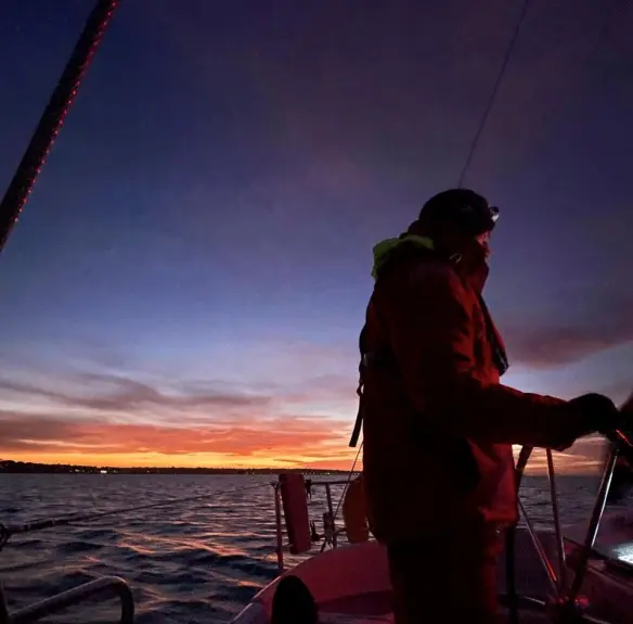 RYA Coastal Skipper students sailing at night on passage from Hamble to Poole.