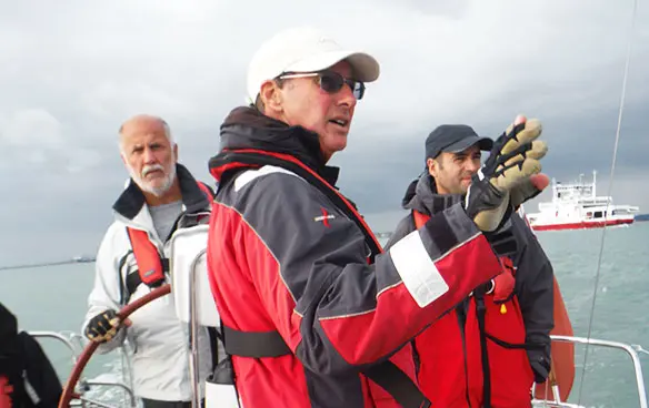 Students working together during an RYA sailing lesson on the Solent