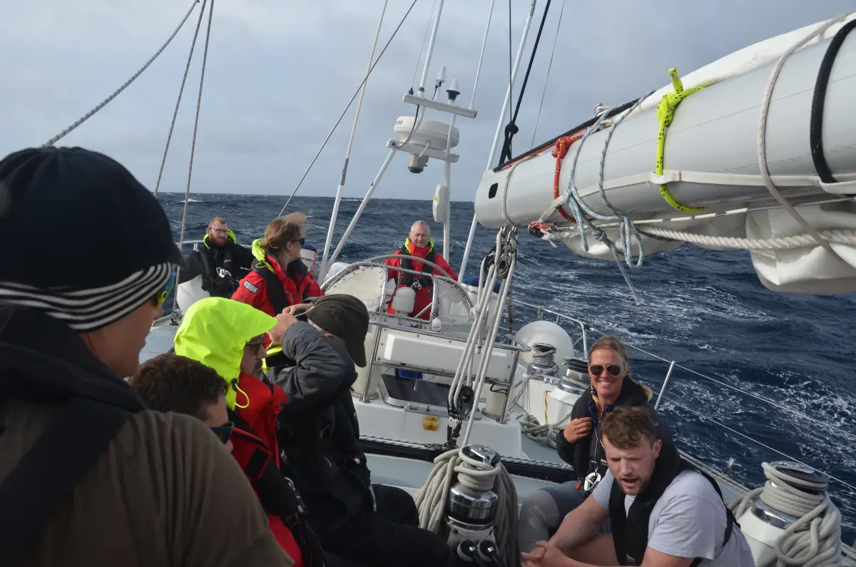Crew about to start reefing sails during North Atlantic return passage from Antigua to Portsmouth