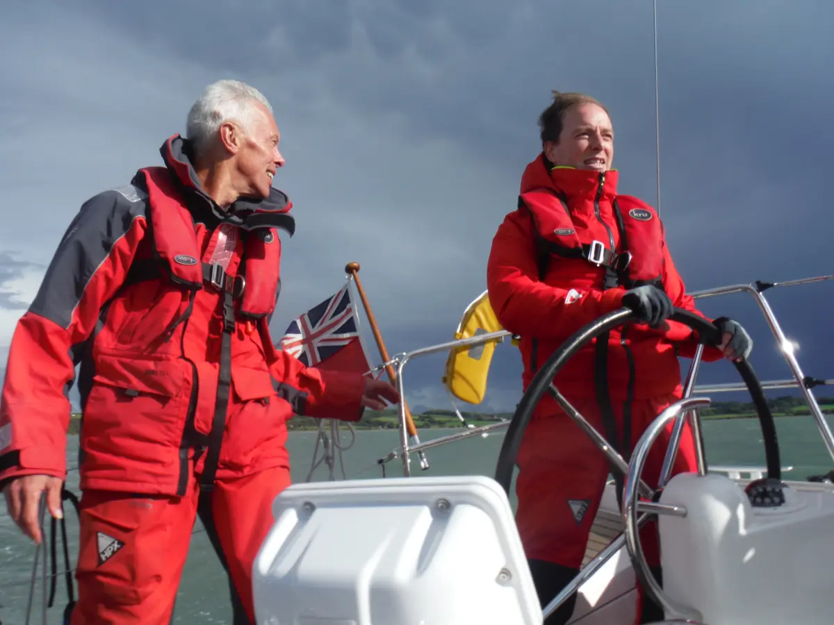 Student skippering yacht under instructor supervision during Channel Triangle mile building trip